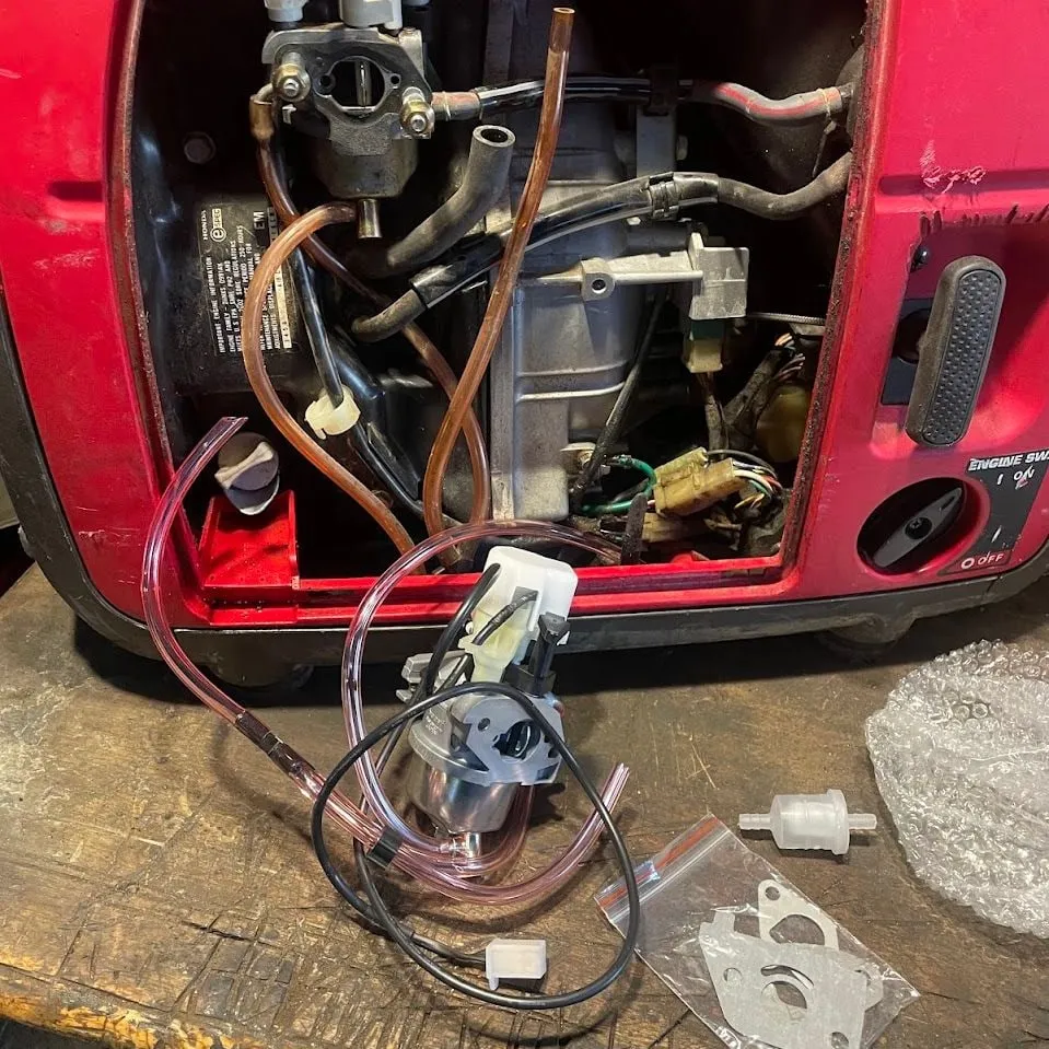 Honda generator with a new carburetor and fuel lines ready to install