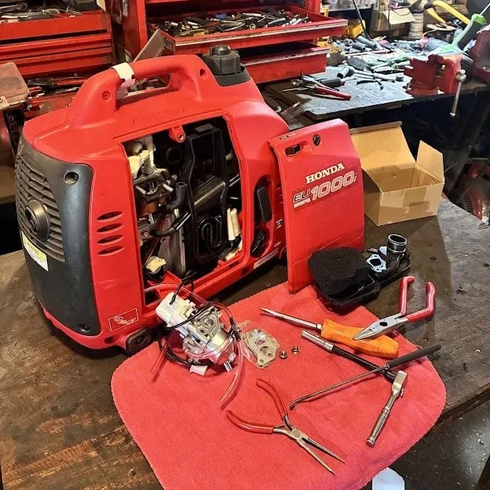 Honda EU1000i generator during a carburetor replacement